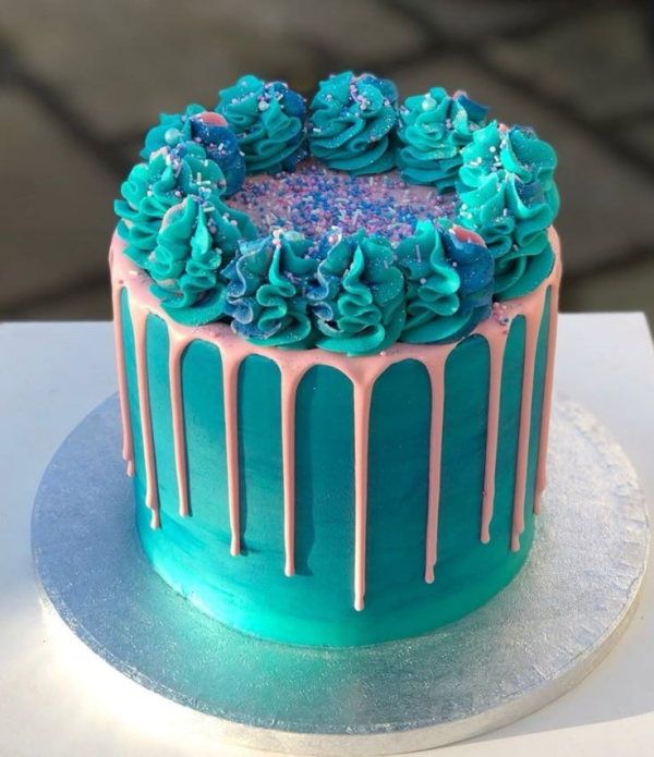 1000435556.webp Blue sprinkles drip cake